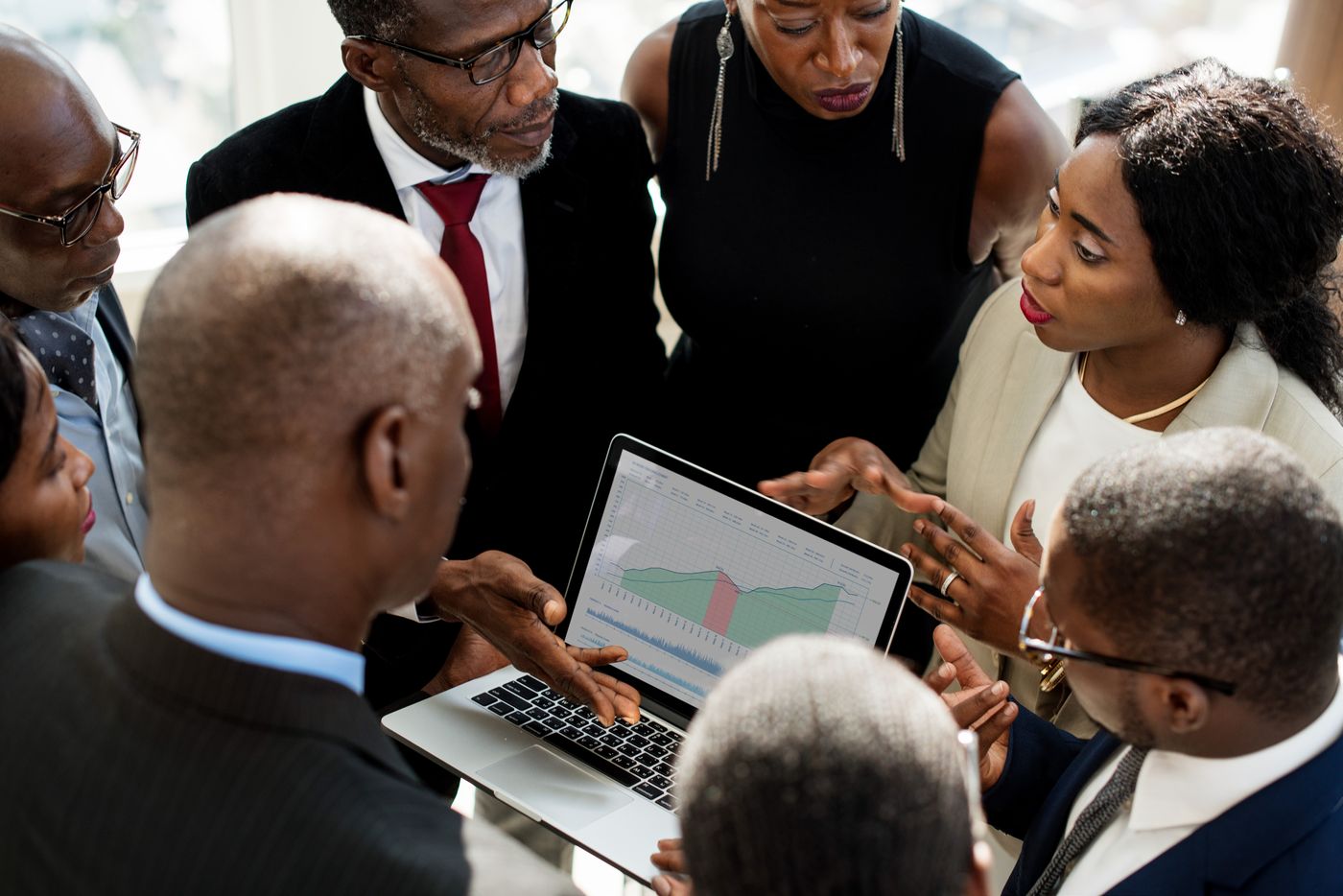 A team reviewing data on a laptop